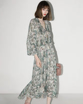 Robe longue en soie à motif floral féerique