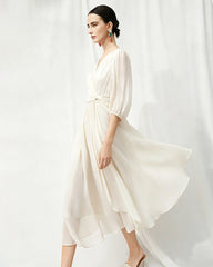 Robe midi en soie à décolleté V avec détail torsadé à la taille