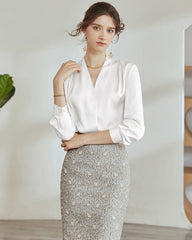 Blouse en soie plissée à col en V