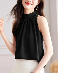 Blouse en soie sans manches à col montant